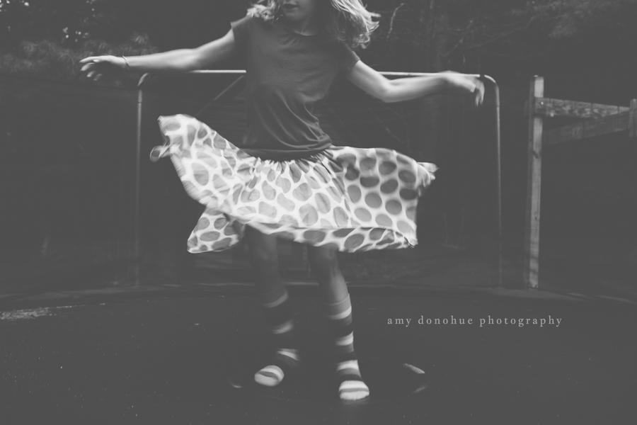 Little girl twirling around Amy Donohue Photography-