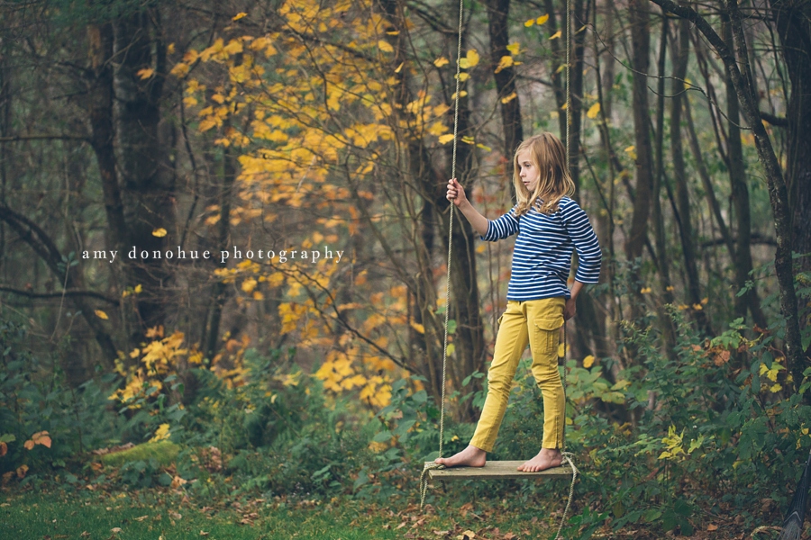 child playing on a swing captured by Amy Donohue Photography-2