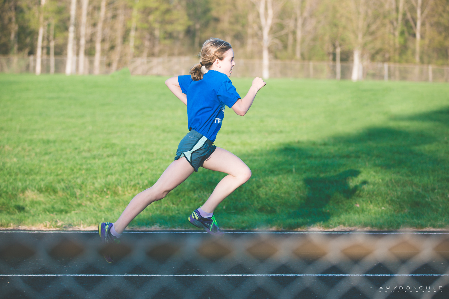 girl running track