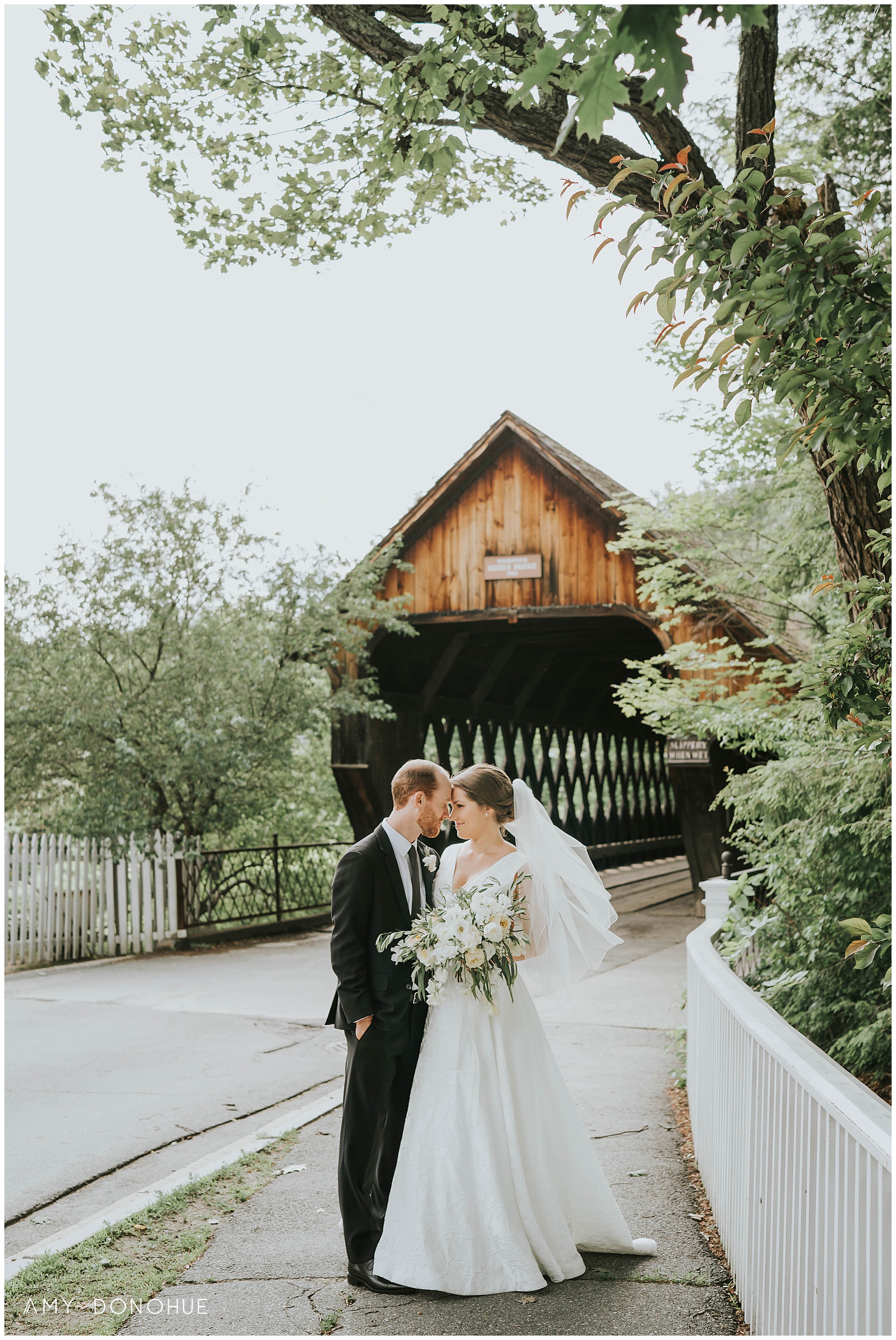 Wedding portraits in front of the covered bridge in Woodstock, Vermont