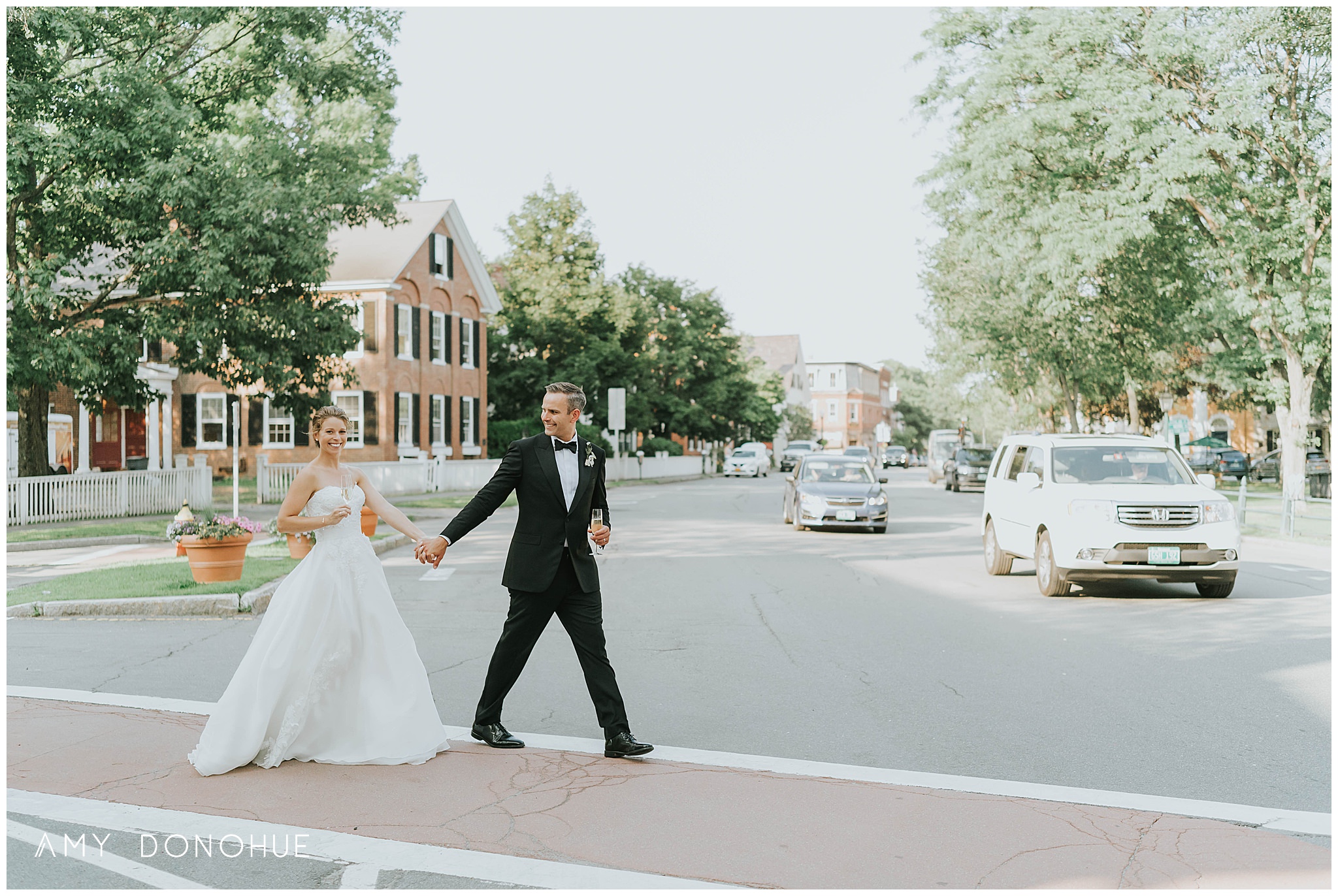 Bride and Groom Walking Across the Street| Vermont Wedding Photographer | Woodstock Inn & Resort | © Amy Donohue Photography